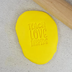 "TEACH LOVE INSPIRE 611" Embosser