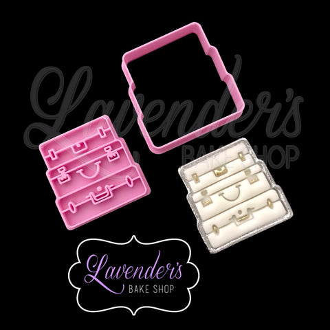 Stacked Suitcase Cutter and Embosser